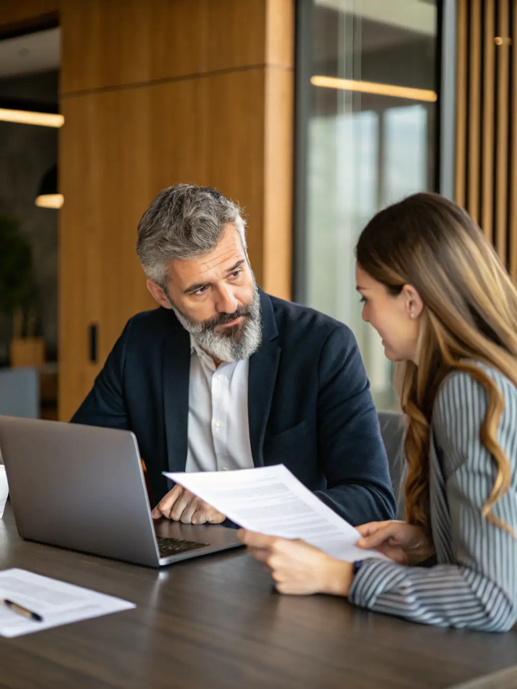 A business coach in a focused pose, guiding a client through a visualization exercise, set in a modern office environment, symbolizing clarity and strategic thinking.